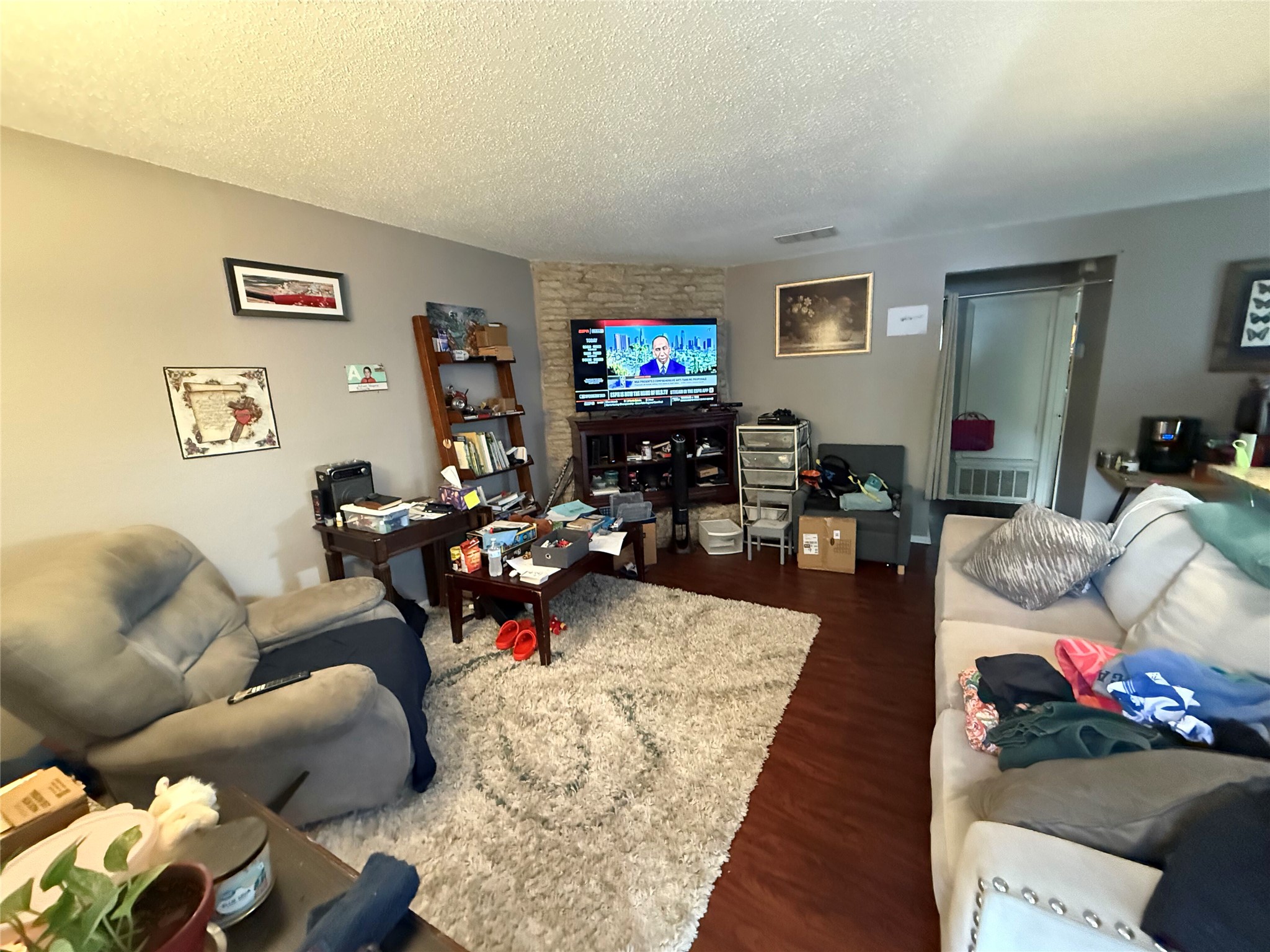 11905 Alpheus Avenue Austin, TX 78759 - Photo 6 of 23 a living room with furniture and a flat screen tv
