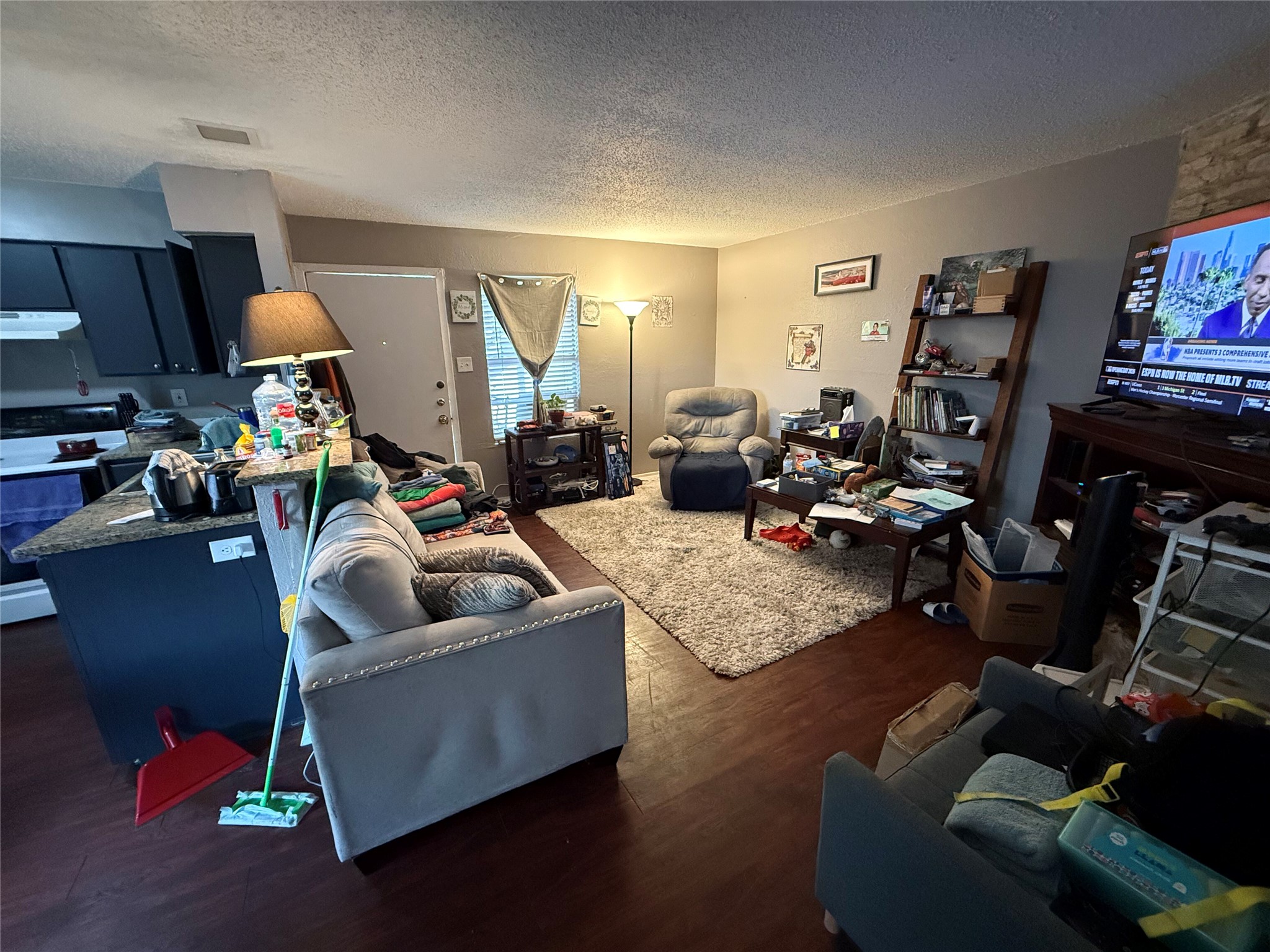 11905 Alpheus Avenue Austin, TX 78759 - Photo 7 of 23 a living room with furniture and a flat screen tv