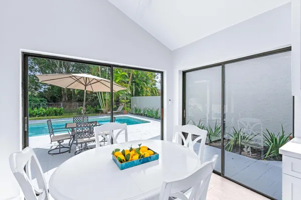 a living room with furniture and garden view