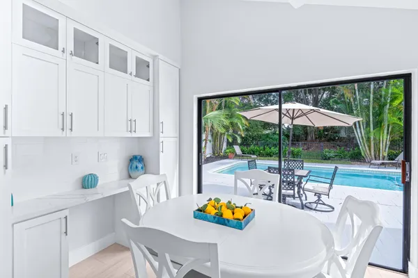 a table and chairs in the kitchen