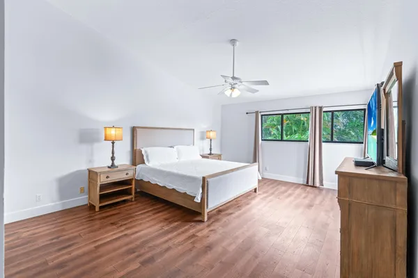 a bedroom with a bed and a chair