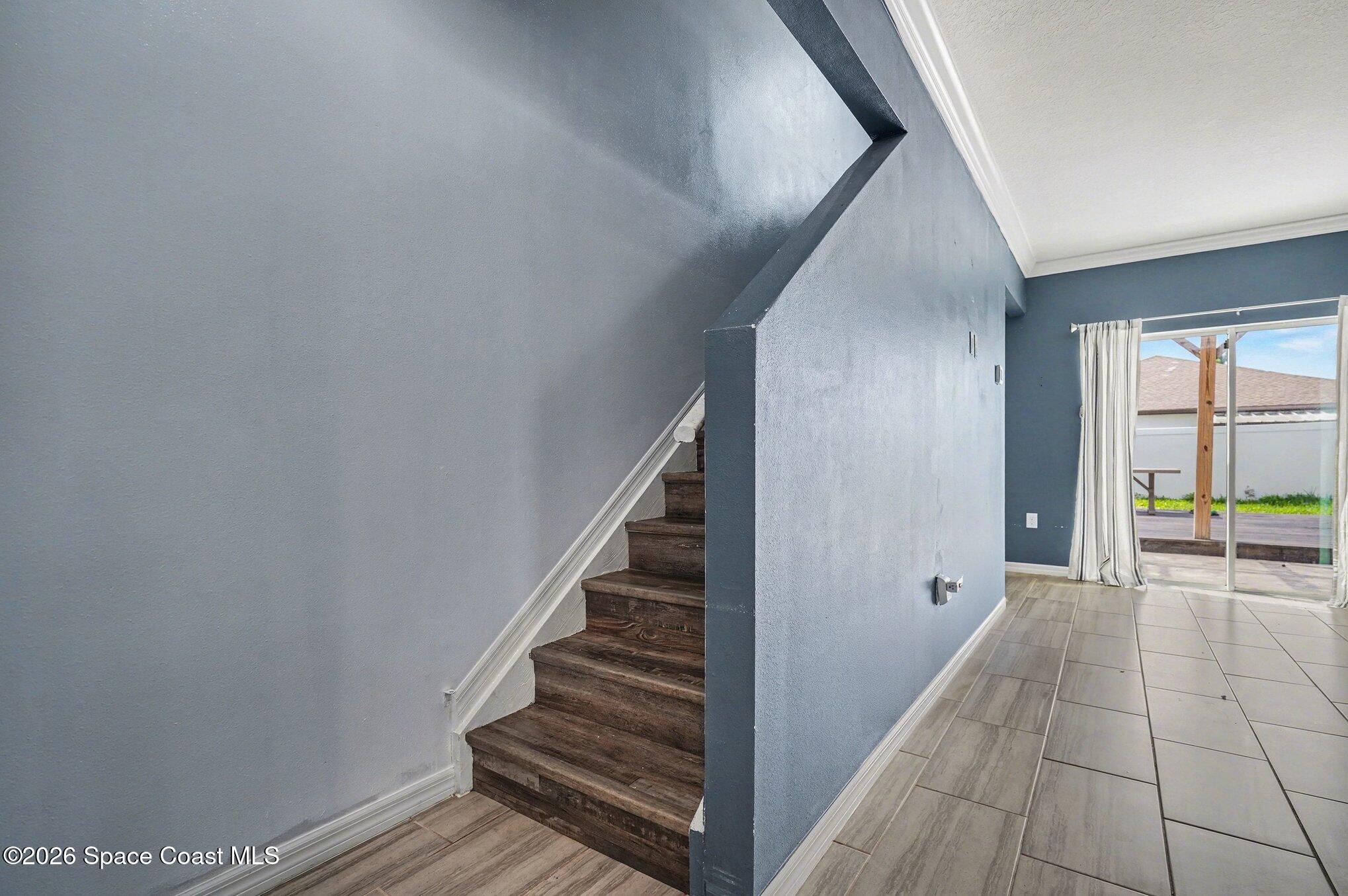 414 Hancock Street Palm Bay, FL 32908 - Photo 14 of 31 a view of a hallway view with staircase