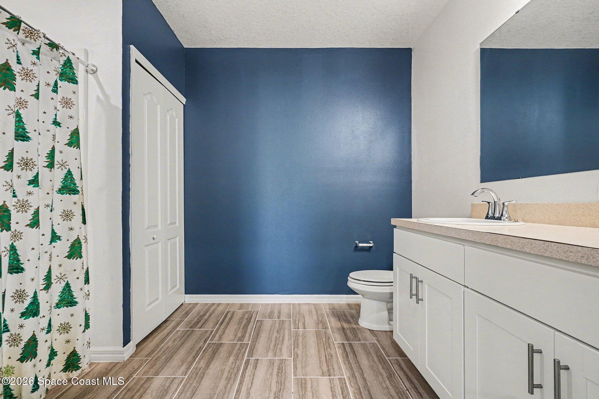414 Hancock Street Palm Bay, FL 32908 - Photo 19 of 31 a bathroom with a sink and a toilet