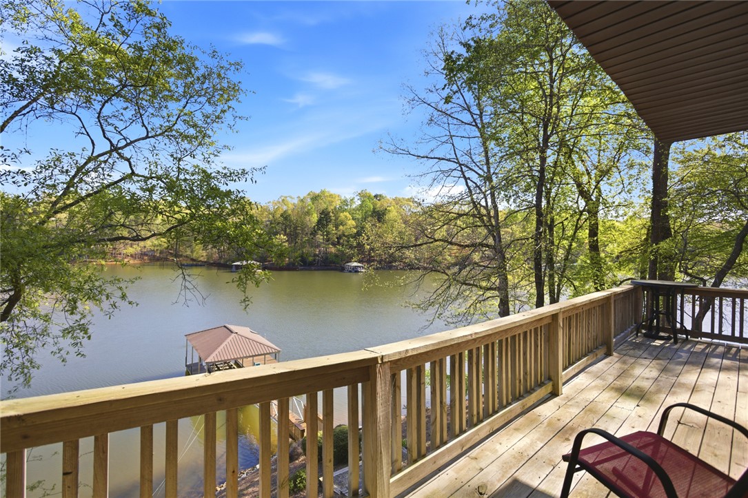 120 Farris Sandra Road West Union, SC 29696 - Photo 13 of 50 Enjoy tranquil lake views from this expansive deck, perfect for peaceful mornings and serene evenings.
