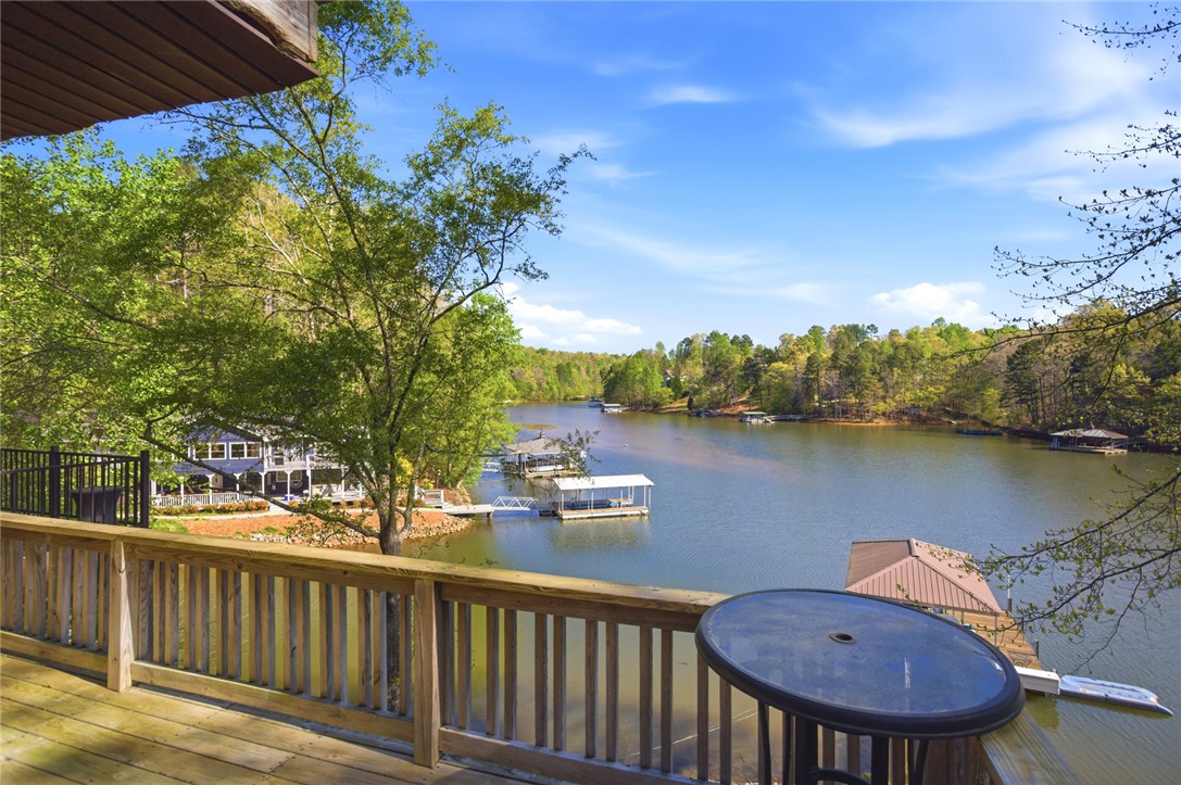120 Farris Sandra Road West Union, SC 29696 - Photo 14 of 50 This expansive deck offers tranquil views of the lake and lush tree-lined shores.