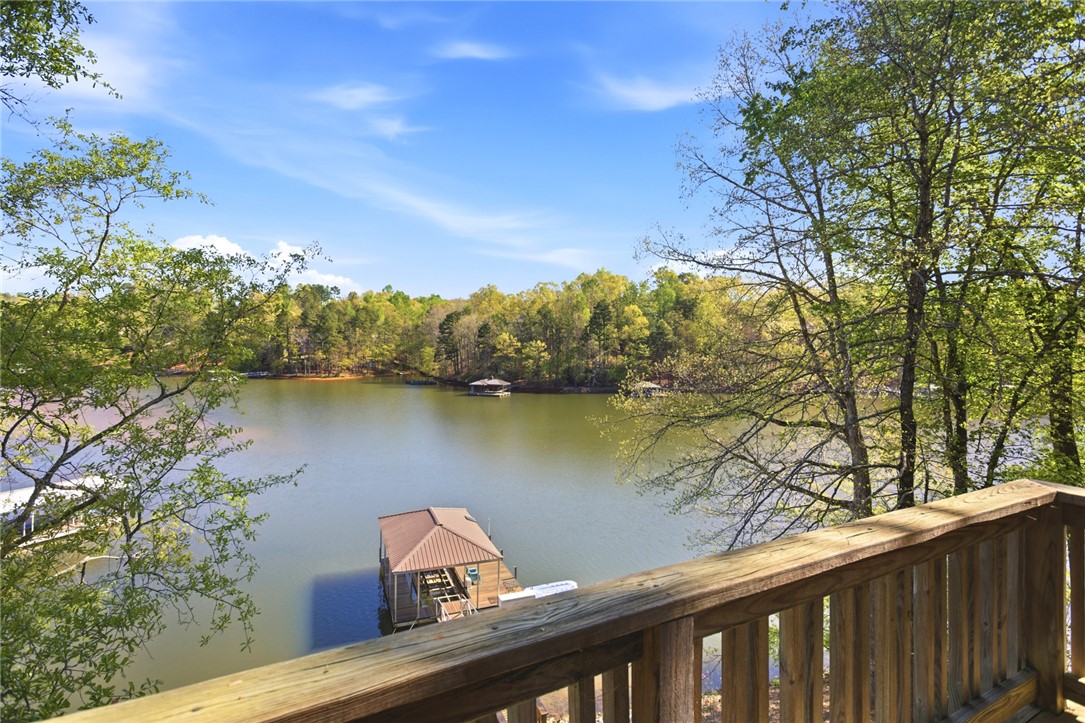 120 Farris Sandra Road West Union, SC 29696 - Photo 15 of 50 Enjoy tranquil water views from this inviting outdoor space, offering direct lake access.