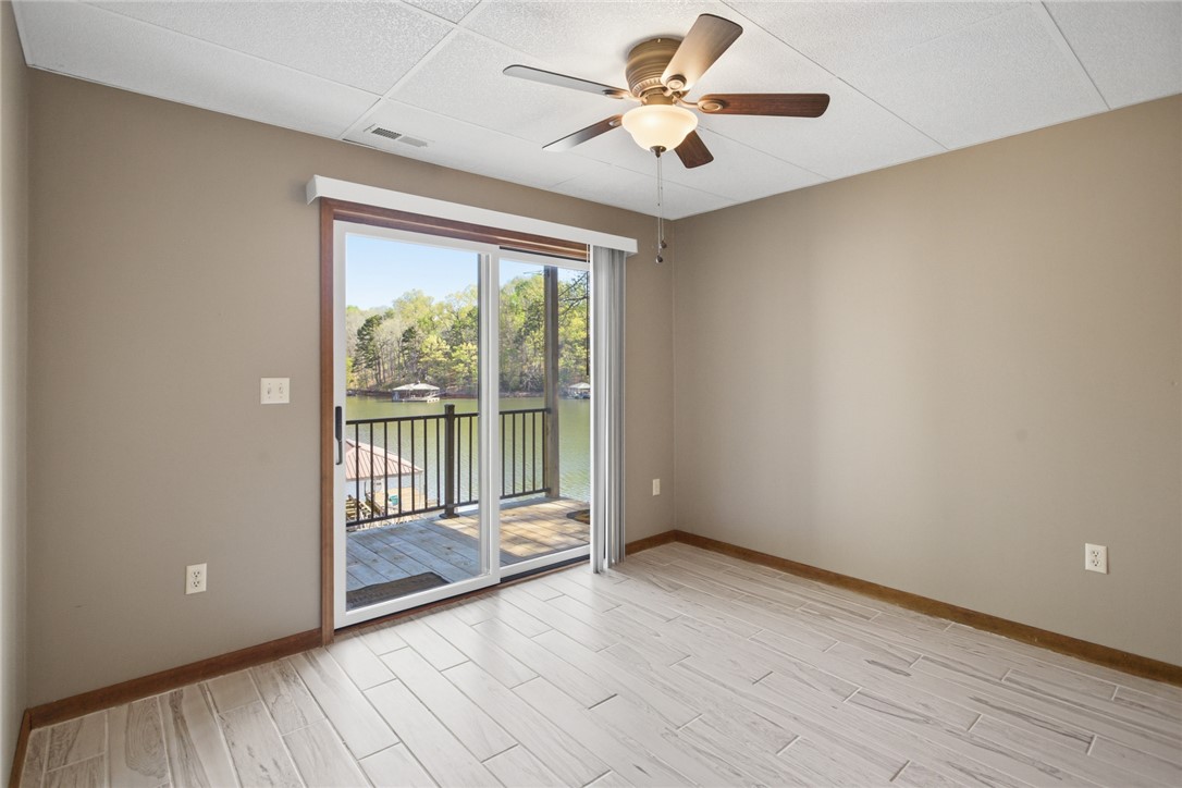 120 Farris Sandra Road West Union, SC 29696 - Photo 25 of 50 This versatile room offers direct access to a private deck overlooking serene waterfront views.