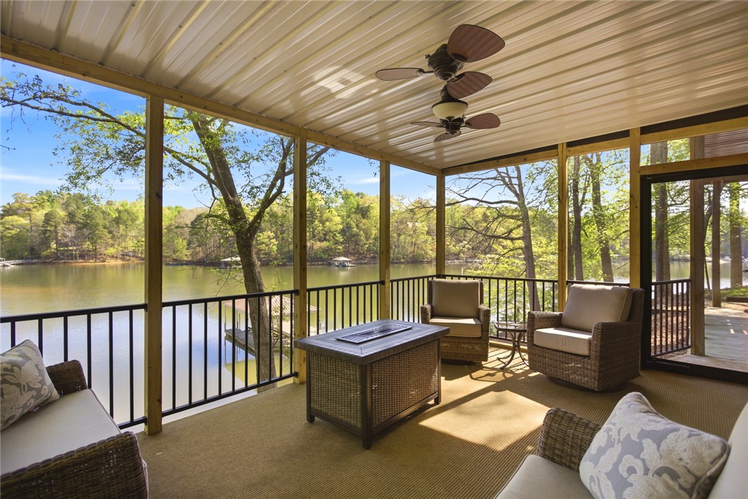 120 Farris Sandra Road West Union, SC 29696 - Photo 27 of 50 Enjoy tranquil lake views from this screened-in porch, ideal for relaxation and entertaining.