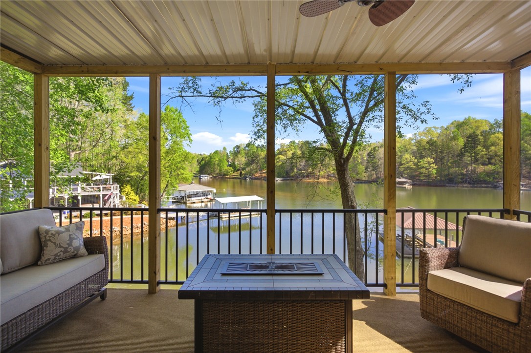 120 Farris Sandra Road West Union, SC 29696 - Photo 29 of 50 This screened porch provides a serene waterfront view, perfect for relaxation.