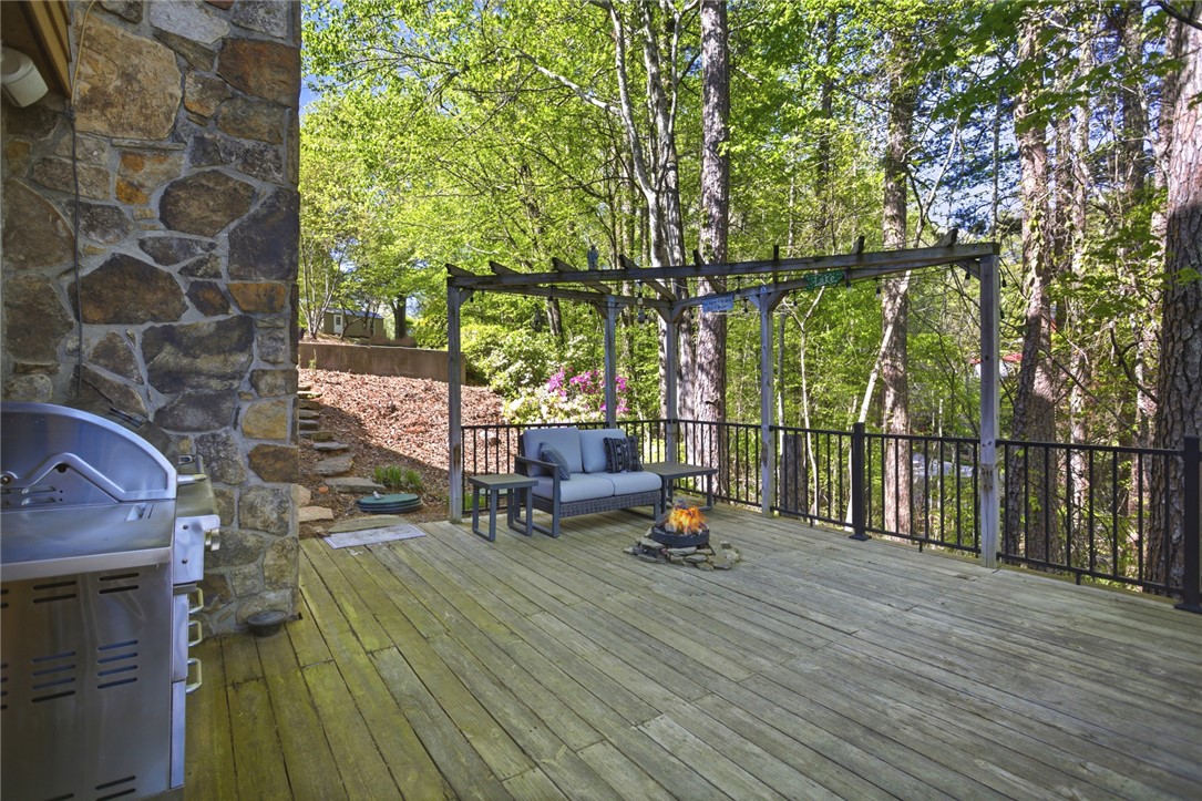 120 Farris Sandra Road West Union, SC 29696 - Photo 30 of 50 This spacious deck offers an inviting outdoor retreat amidst lush, natural surroundings.