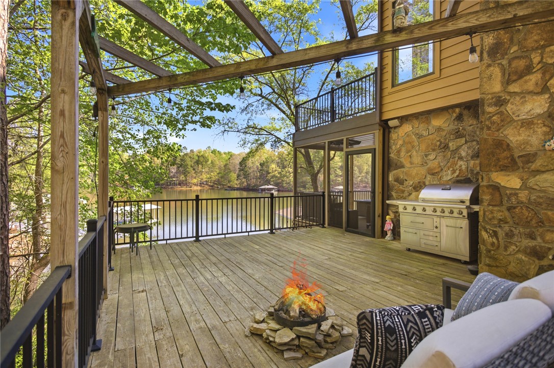 120 Farris Sandra Road West Union, SC 29696 - Photo 31 of 50 This spacious deck provides an ideal setting for outdoor gatherings and offers scenic water views.