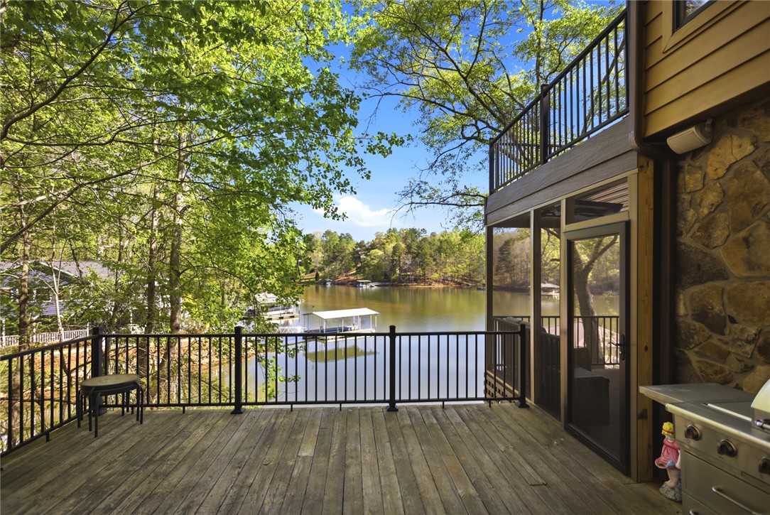120 Farris Sandra Road West Union, SC 29696 - Photo 32 of 50 Enjoy direct lake access and outdoor living from this inviting two-level deck with expansive water views.