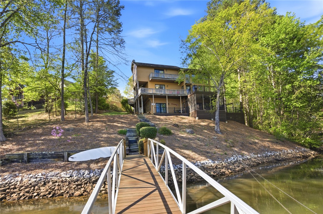 120 Farris Sandra Road West Union, SC 29696 - Photo 48 of 50 This home boasts expansive outdoor living spaces, a private dock, and stunning water views.
