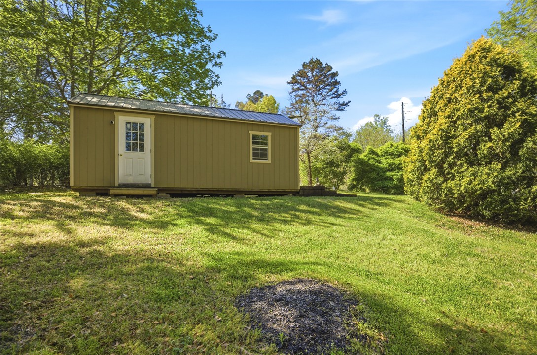120 Farris Sandra Road West Union, SC 29696 - Photo 49 of 50 This charming outbuilding offers additional functional space on a lush, verdant lot.