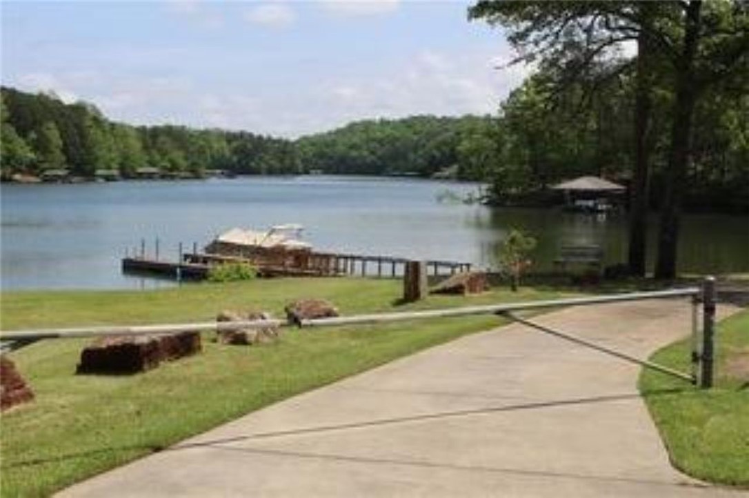 120 Farris Sandra Road West Union, SC 29696 - Photo 50 of 50 This serene lakeside property features a private boat dock and lush green surroundings.
