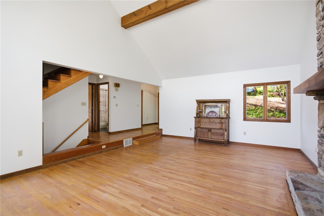 120 Farris Sandra Road West Union, SC 29696 - Photo 6 of 50 This expansive living area features soaring ceilings and natural light, creating an inviting atmosphere.