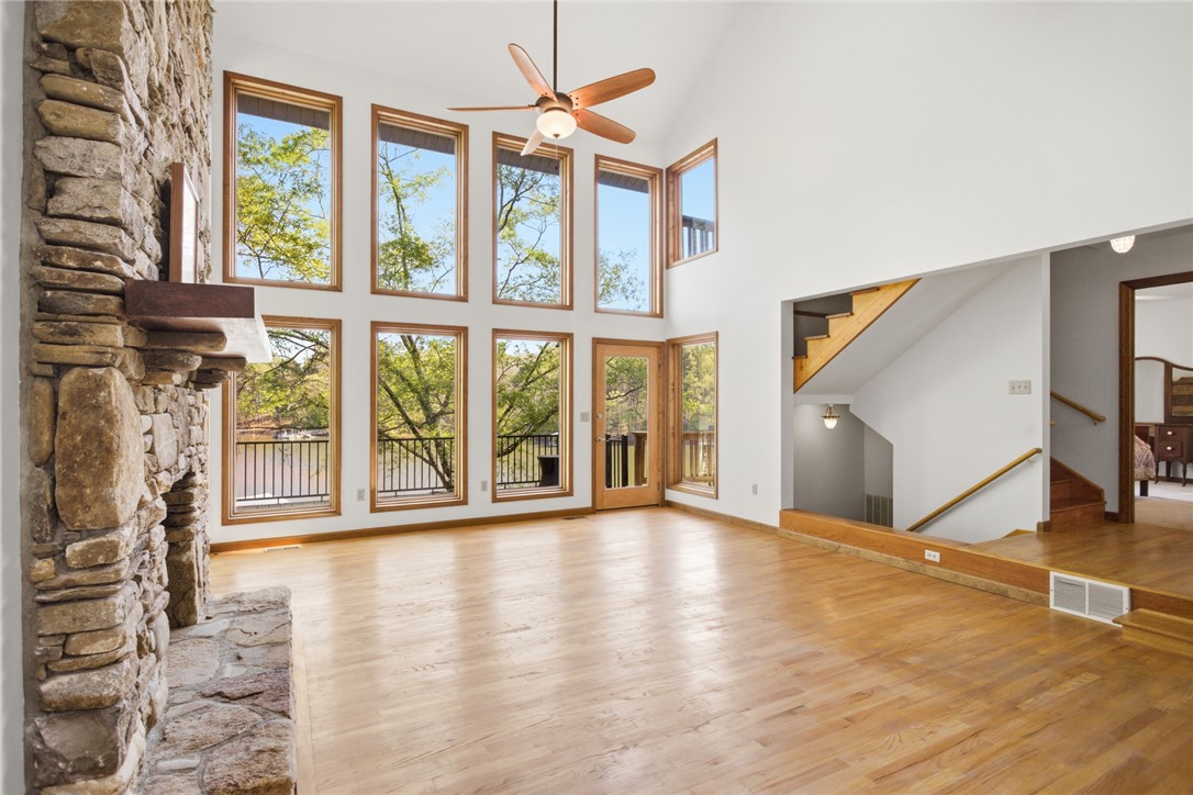 120 Farris Sandra Road West Union, SC 29696 - Photo 8 of 50 This airy living space features soaring ceilings, a stone fireplace, and captivating views.