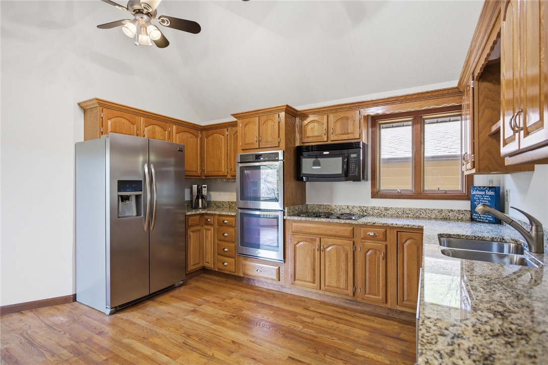 120 Farris Sandra Road West Union, SC 29696 - Photo 10 of 50 This bright kitchen features wood cabinetry and ample countertop space.
