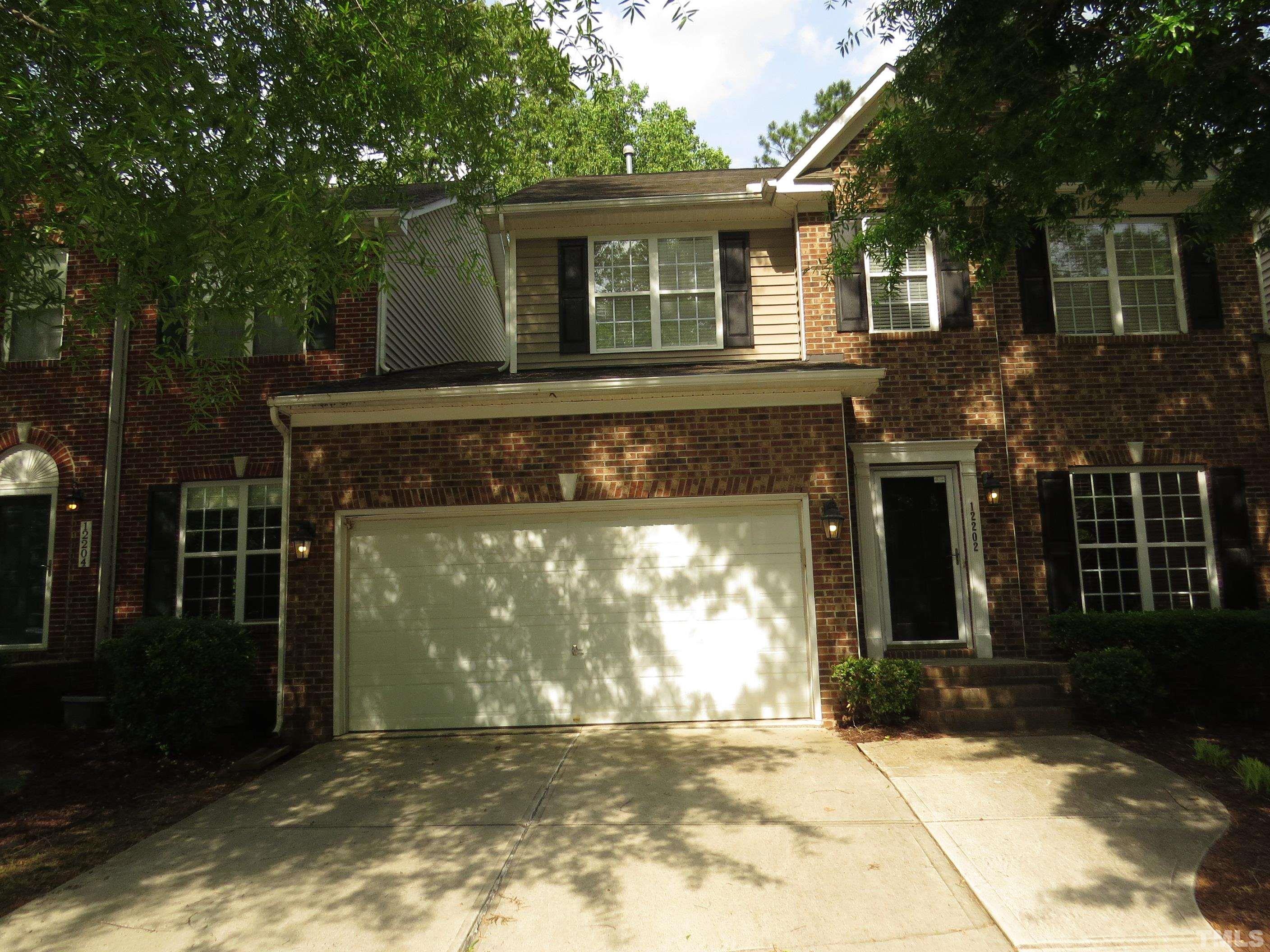12202 Fox Valley Street Raleigh, NC 27614 - Photo 1 of 24 a front view of a house with a yard