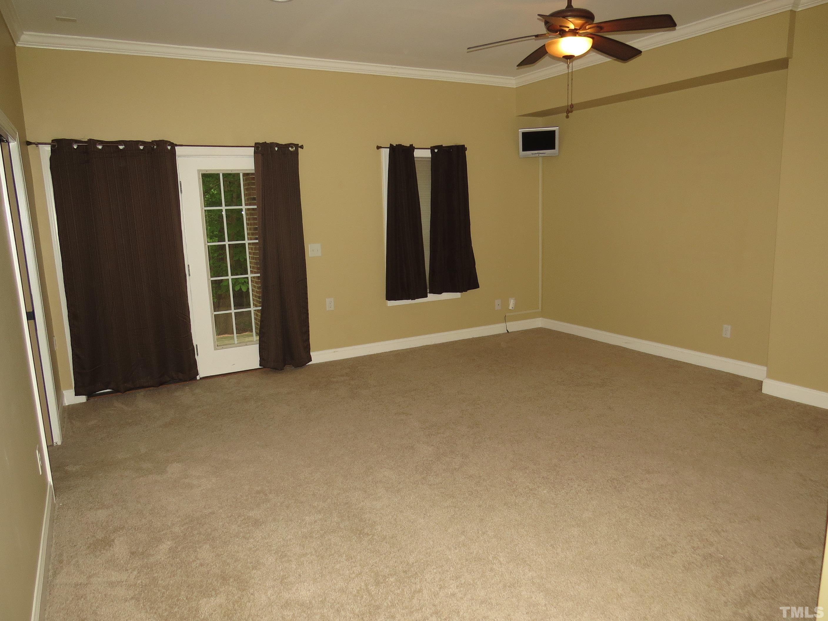 12202 Fox Valley Street Raleigh, NC 27614 - Photo 21 of 24 a view of an empty room with a window