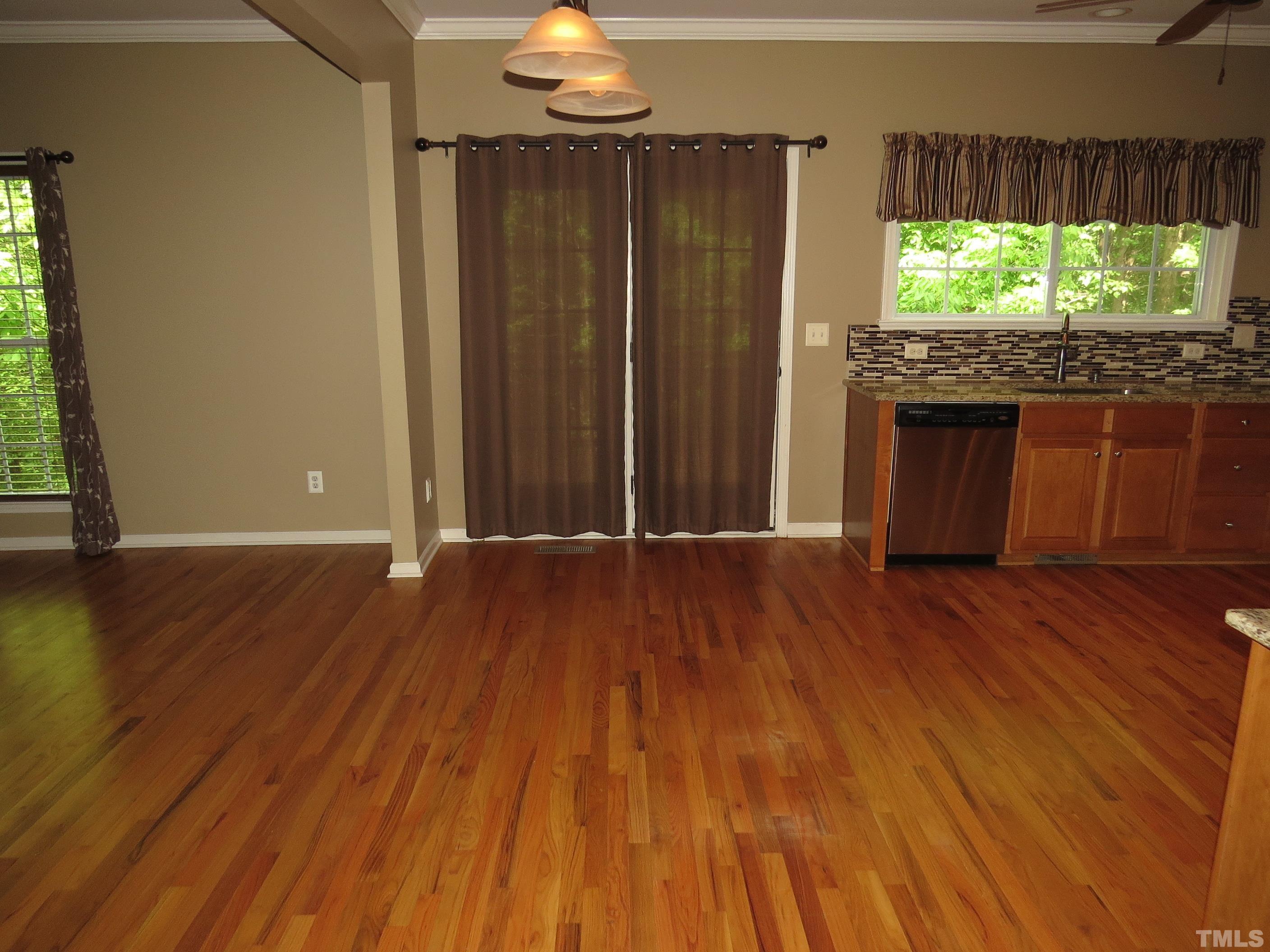 12202 Fox Valley Street Raleigh, NC 27614 - Photo 5 of 24 a view of room with window and wooden floor