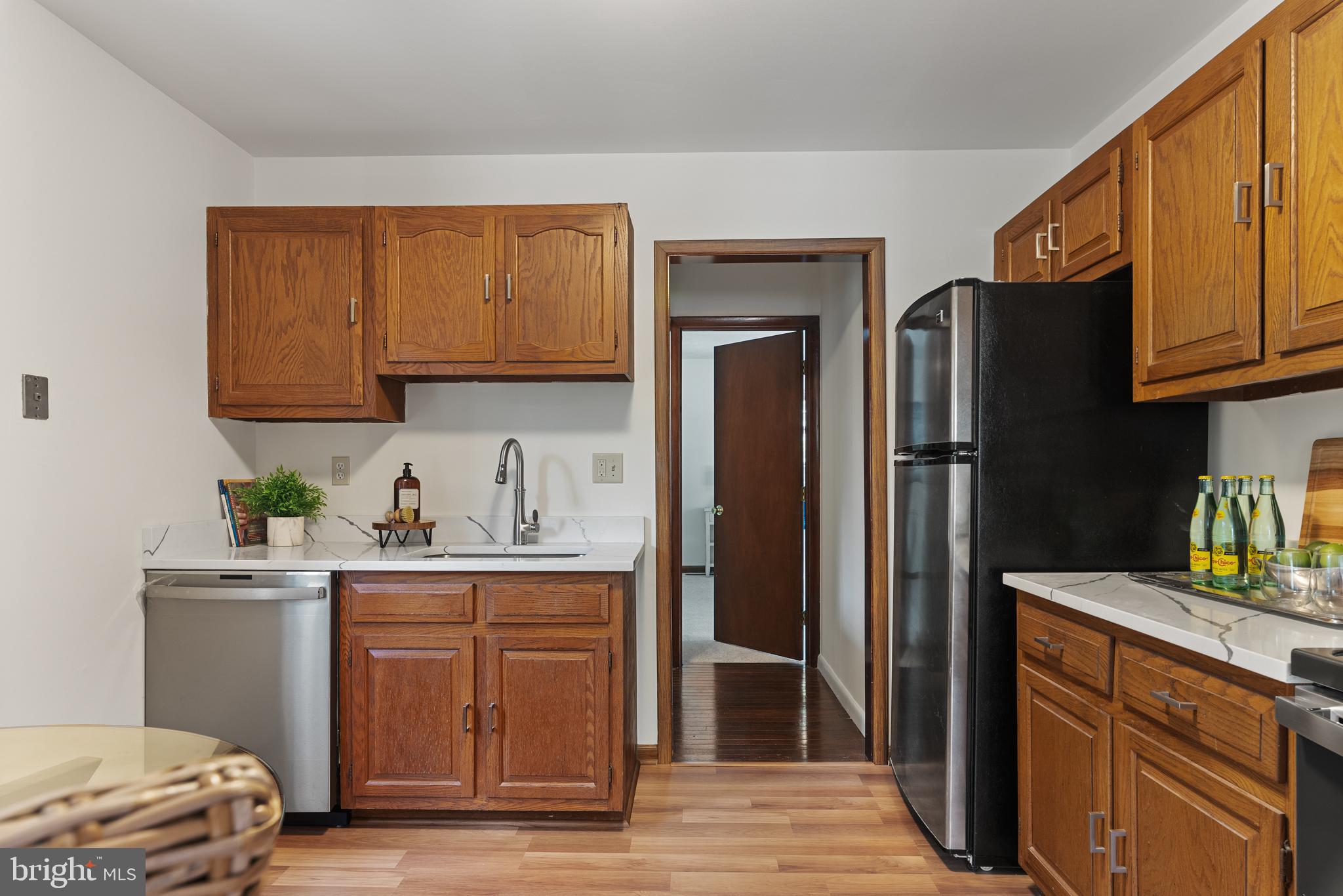 534 Londontown Road Edgewater, MD 21037 - Photo 13 of 59 a kitchen with a refrigerator and a sink