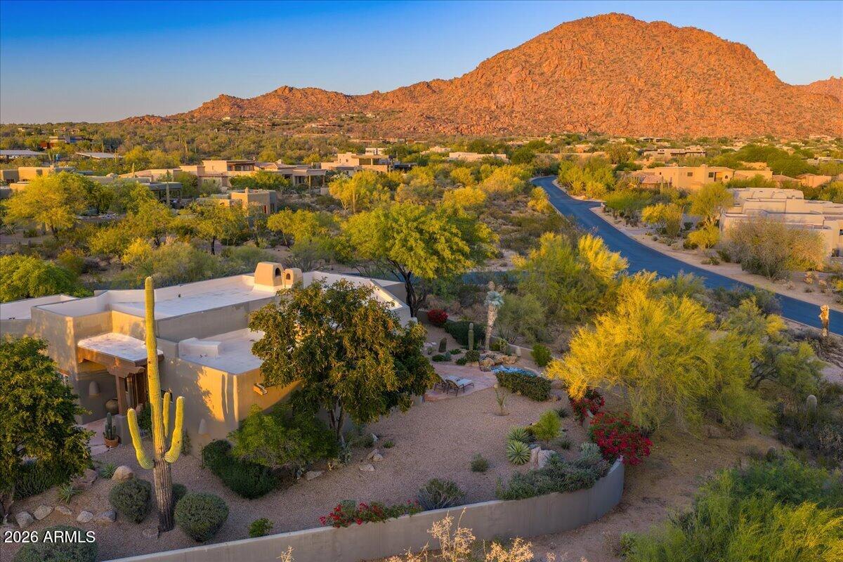 10040 East Happy Valley Road, Unit 404 Scottsdale, AZ 85255 - Photo 3 of 4 an aerial view of residential houses with outdoor space and trees