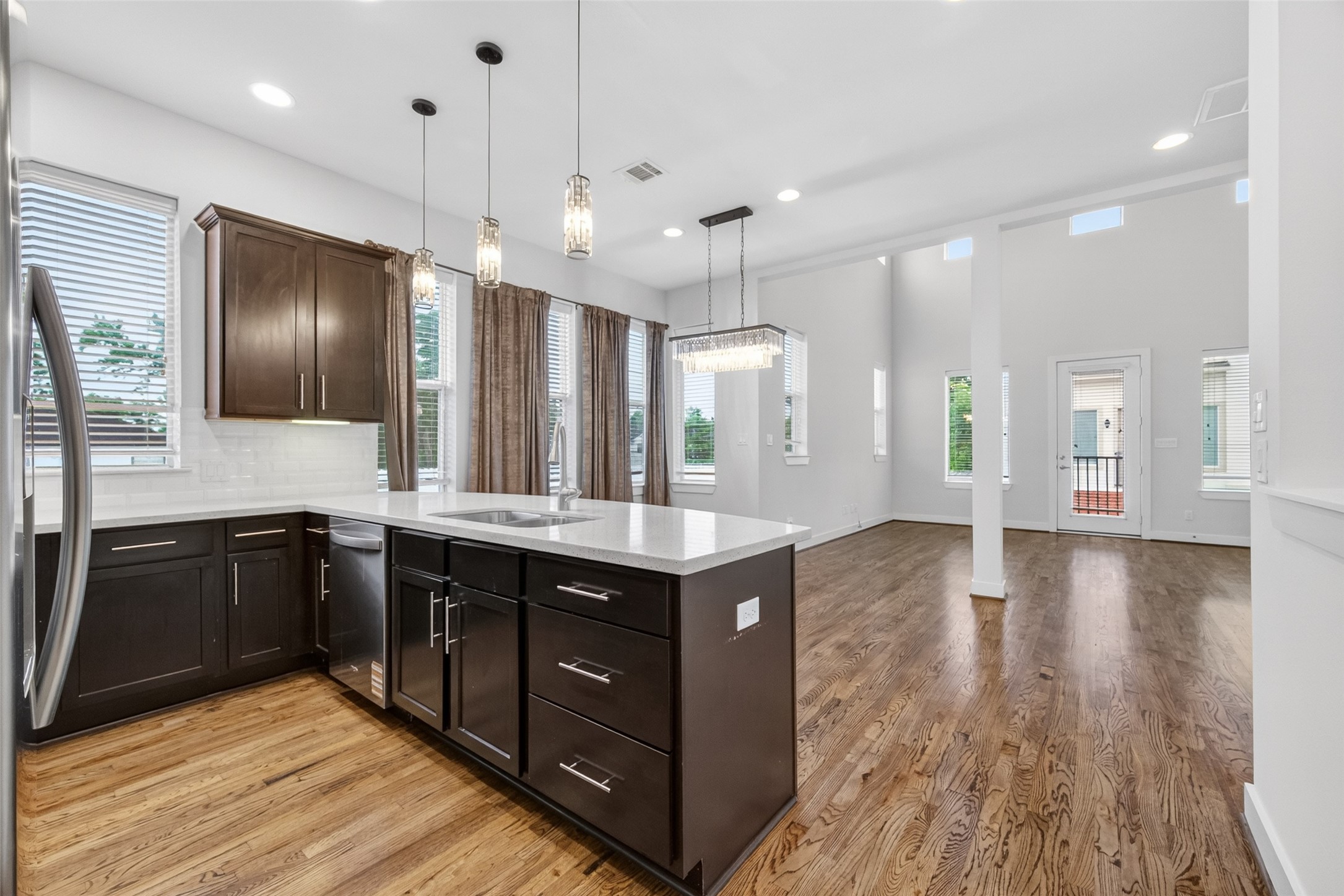 1202 Cedarpost Tree Springs Place Houston, TX 77055 - Photo 12 of 45 a kitchen with a stove kitchen island and stainless steel appliances
