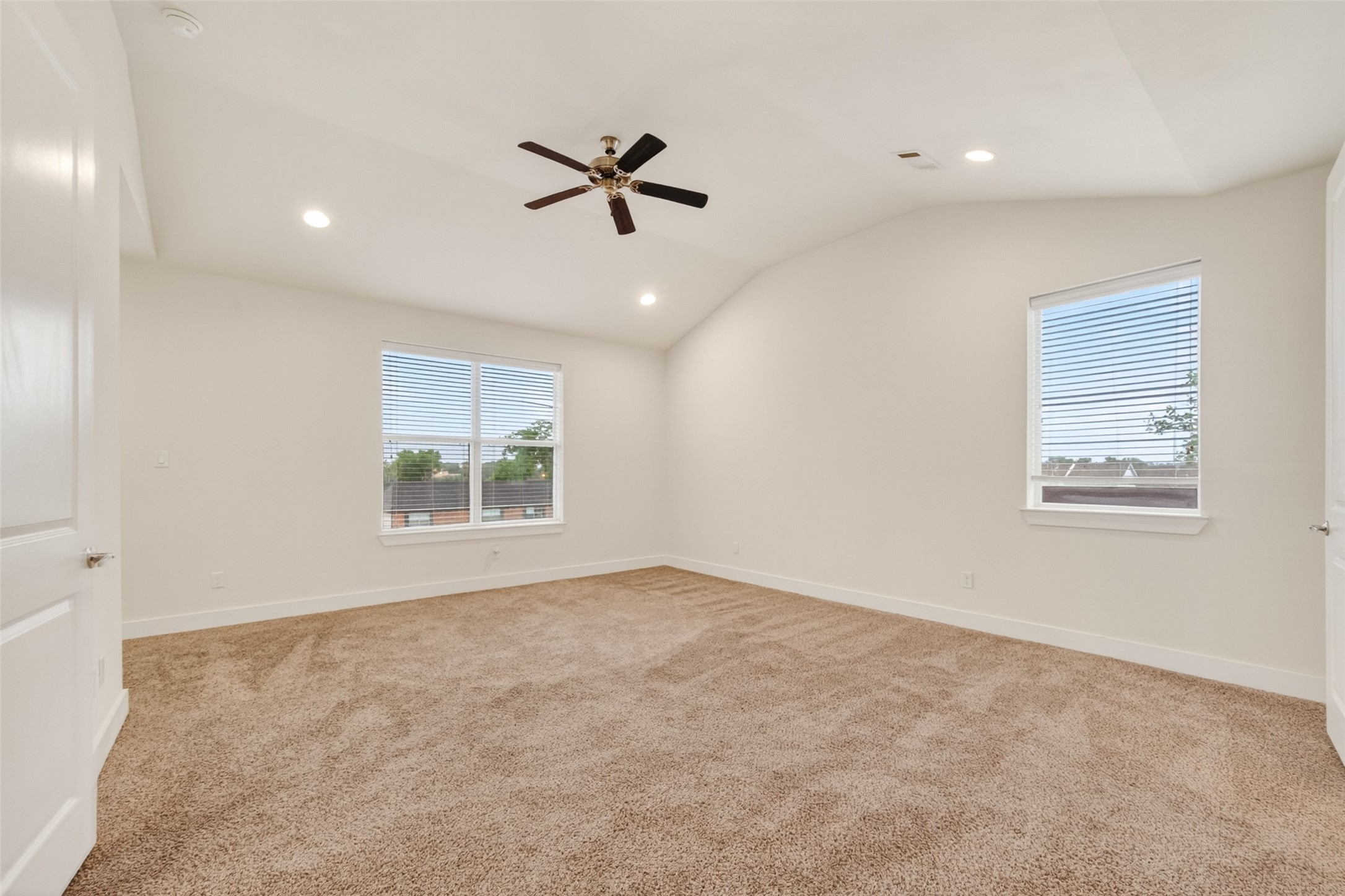 1202 Cedarpost Tree Springs Place Houston, TX 77055 - Photo 22 of 45 a view of an empty room with a window