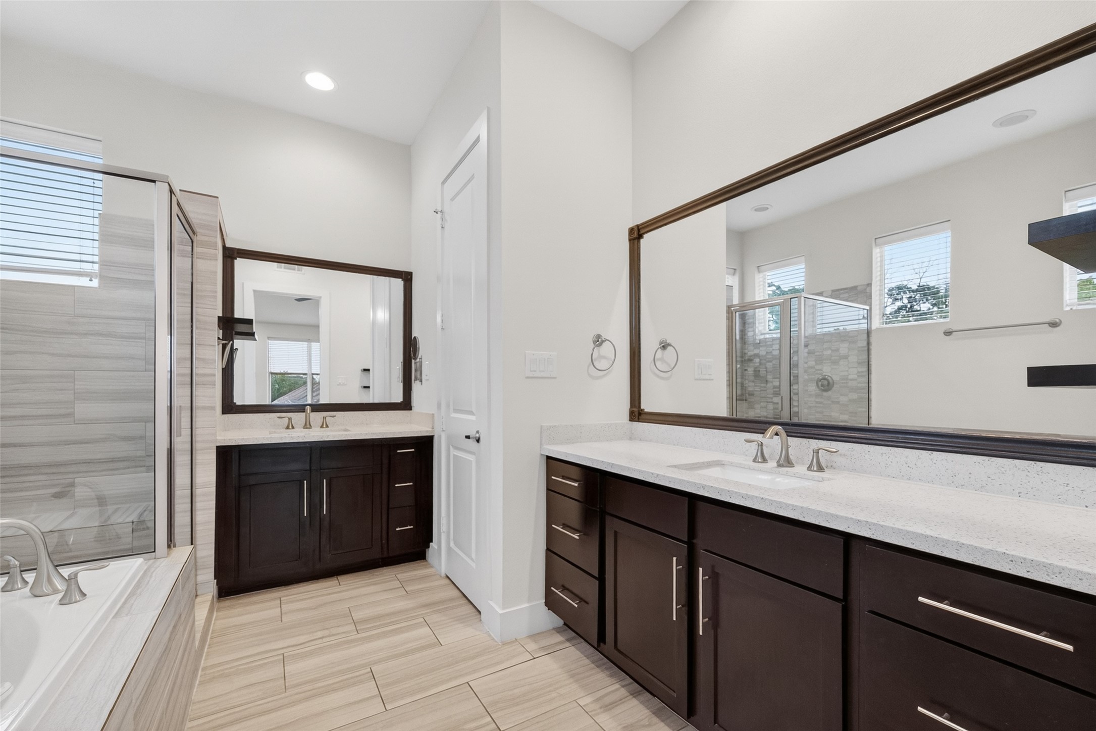 1202 Cedarpost Tree Springs Place Houston, TX 77055 - Photo 24 of 45 a bathroom with a sink vanity granite tub shower and a mirror