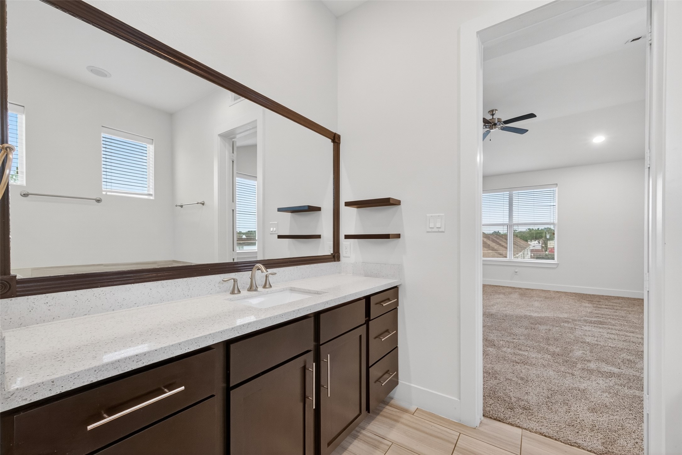 1202 Cedarpost Tree Springs Place Houston, TX 77055 - Photo 26 of 45 a bathroom with a sink and a mirror