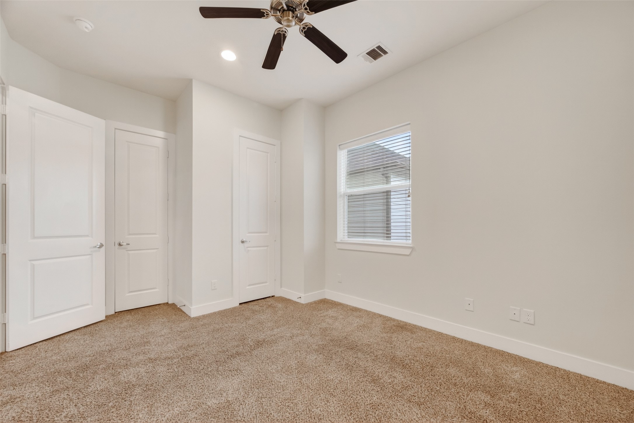1202 Cedarpost Tree Springs Place Houston, TX 77055 - Photo 32 of 45 a view of a livingroom with a ceiling fan and window