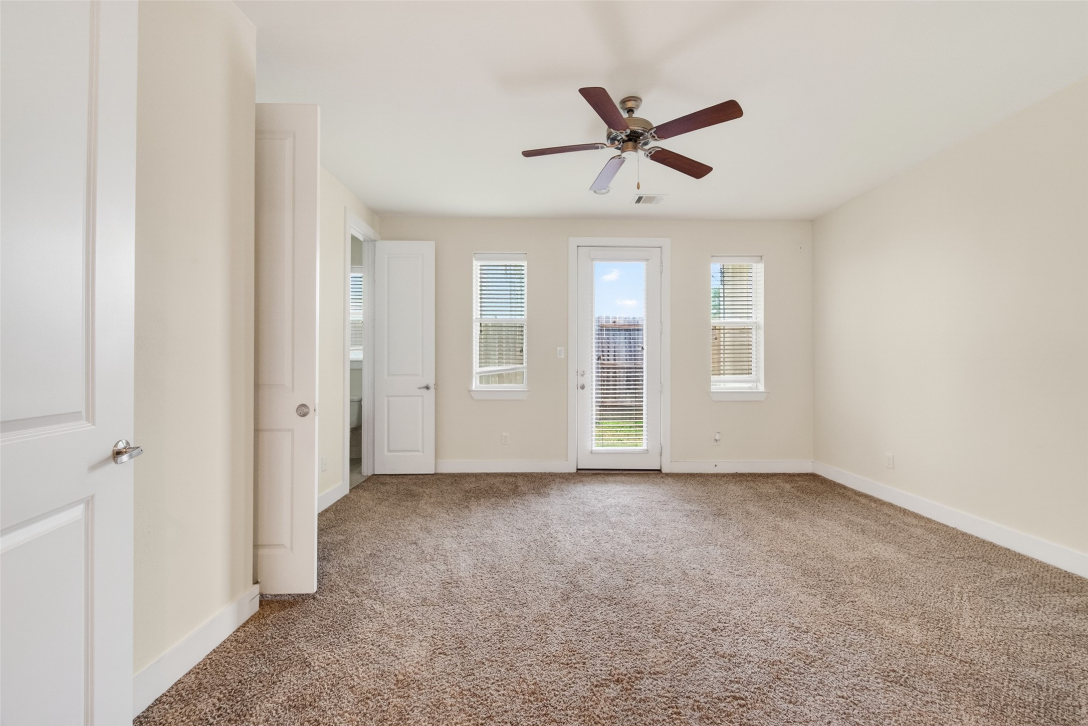 1202 Cedarpost Tree Springs Place Houston, TX 77055 - Photo 34 of 45 an empty room with windows and fan