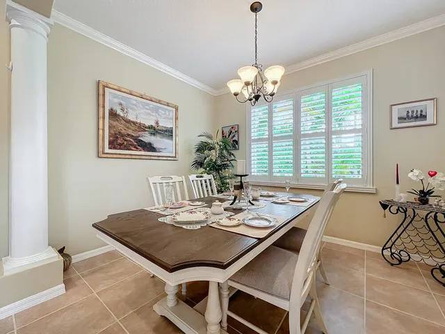 a view of a dining room and a livingroom with furniture