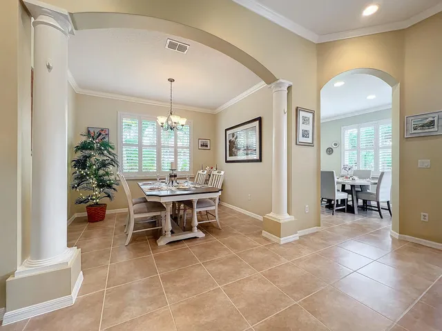 a view of a dining room with furniture window and outside view