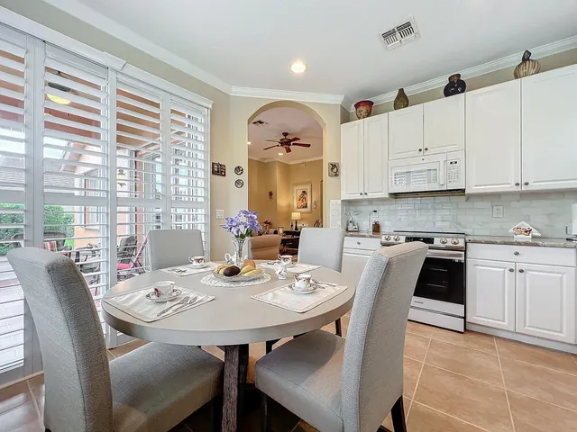 a stove top oven sitting inside of a kitchen