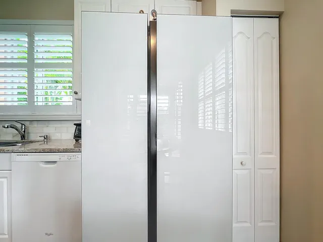 a bedroom with a bed dresser and wooden floor