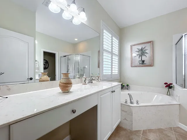 a white bath tub sitting next to a window
