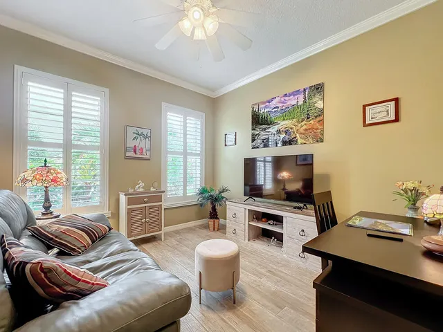 a bedroom with a bed and a television