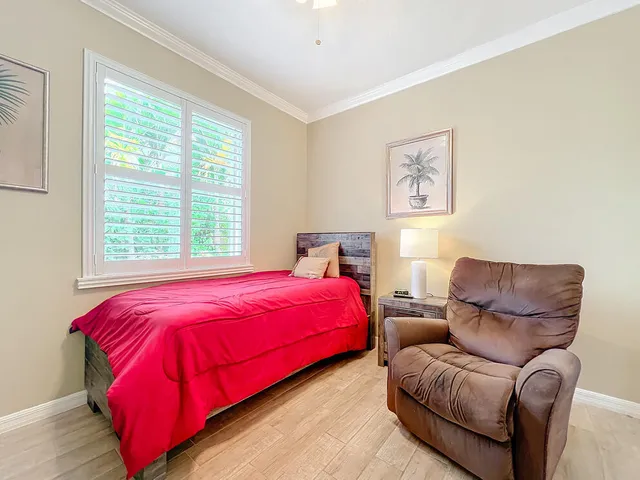 a view of a room with furniture and a window