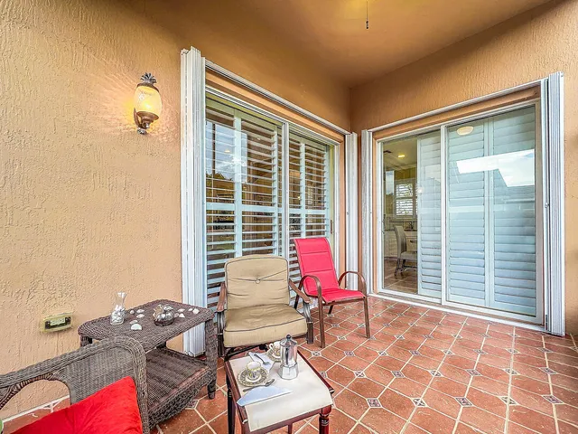 an aerial view of a house with outdoor space and a lake view