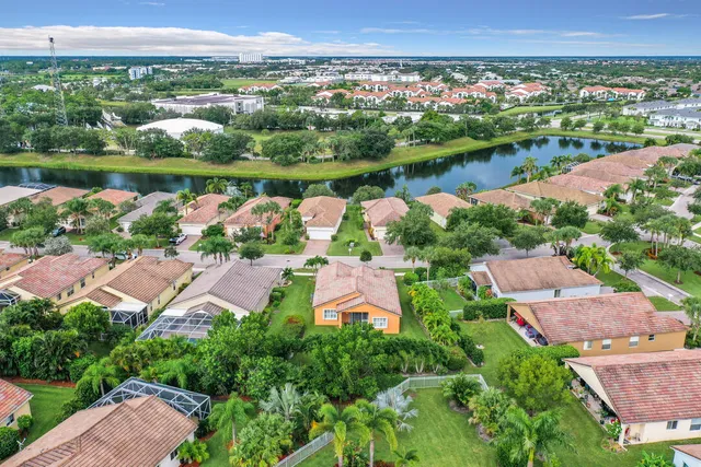 a view of a dining room and livingroom with furniture window and wooden floor