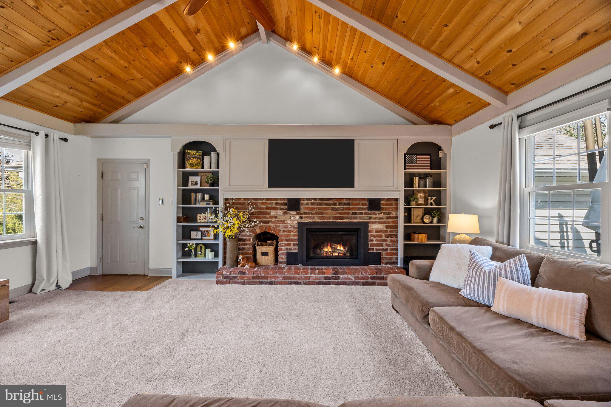 85 Brownsburg Road Newtown, PA 18940 - Photo 11 of 66 a living room with furniture a fireplace and a flat screen tv