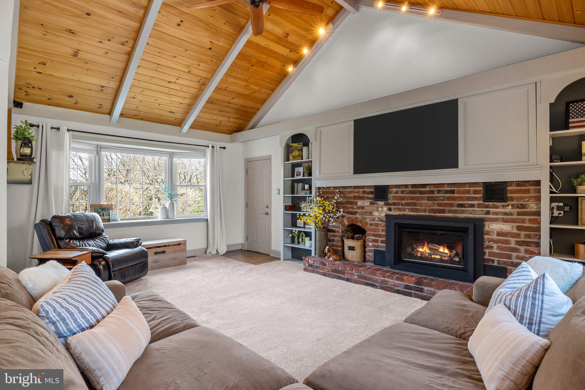 85 Brownsburg Road Newtown, PA 18940 - Photo 12 of 66 a living room with furniture window and a fireplace