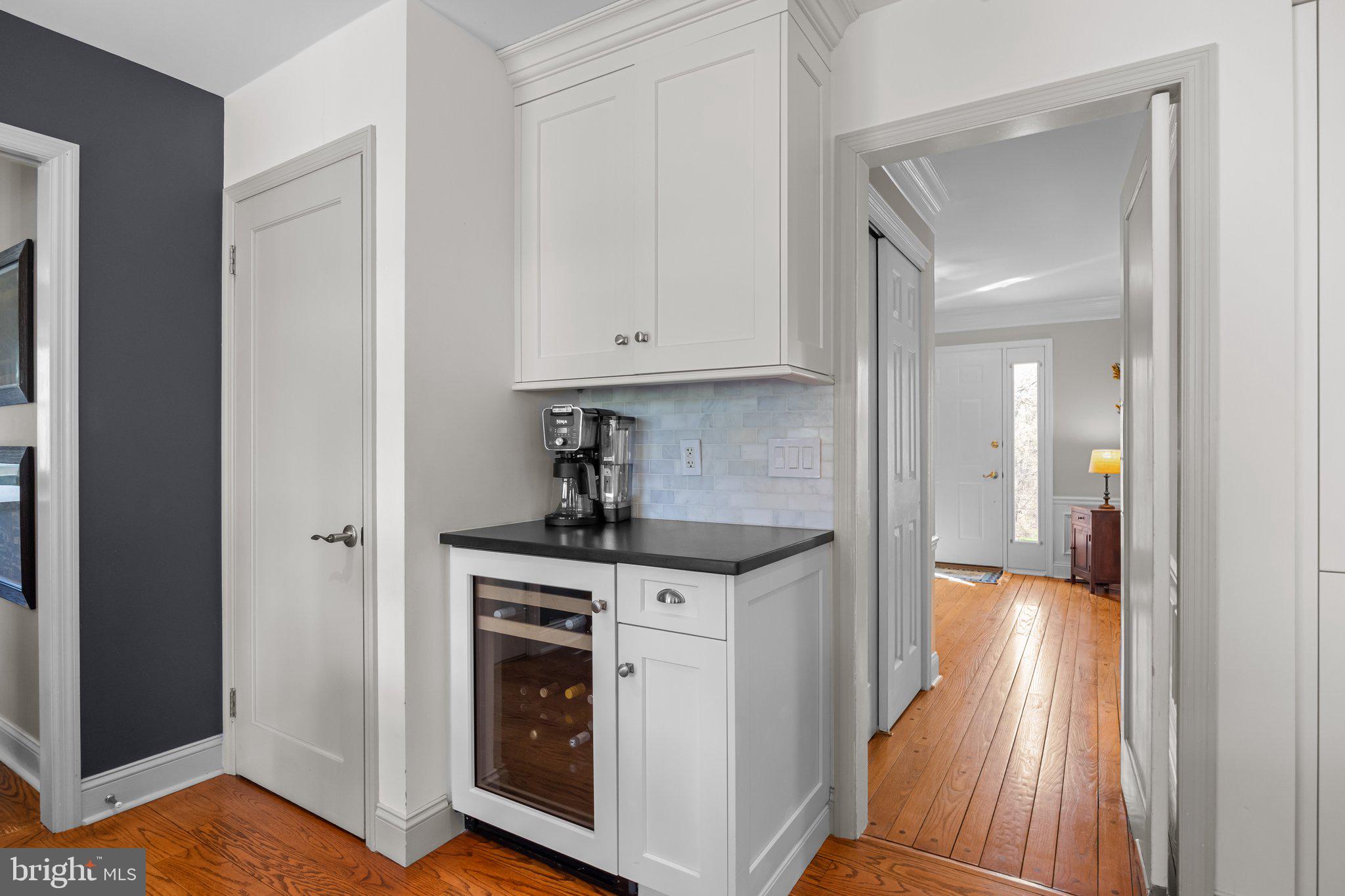 85 Brownsburg Road Newtown, PA 18940 - Photo 29 of 66 a kitchen with white cabinets and wooden floor