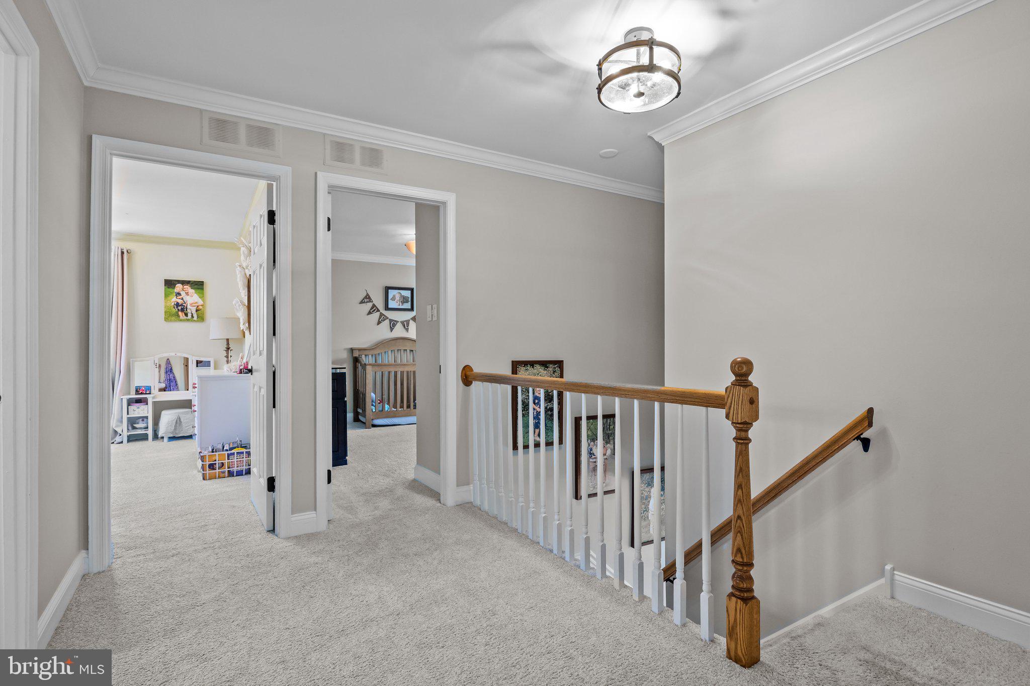 85 Brownsburg Road Newtown, PA 18940 - Photo 42 of 66 a view of a hallway with paintings on the wall