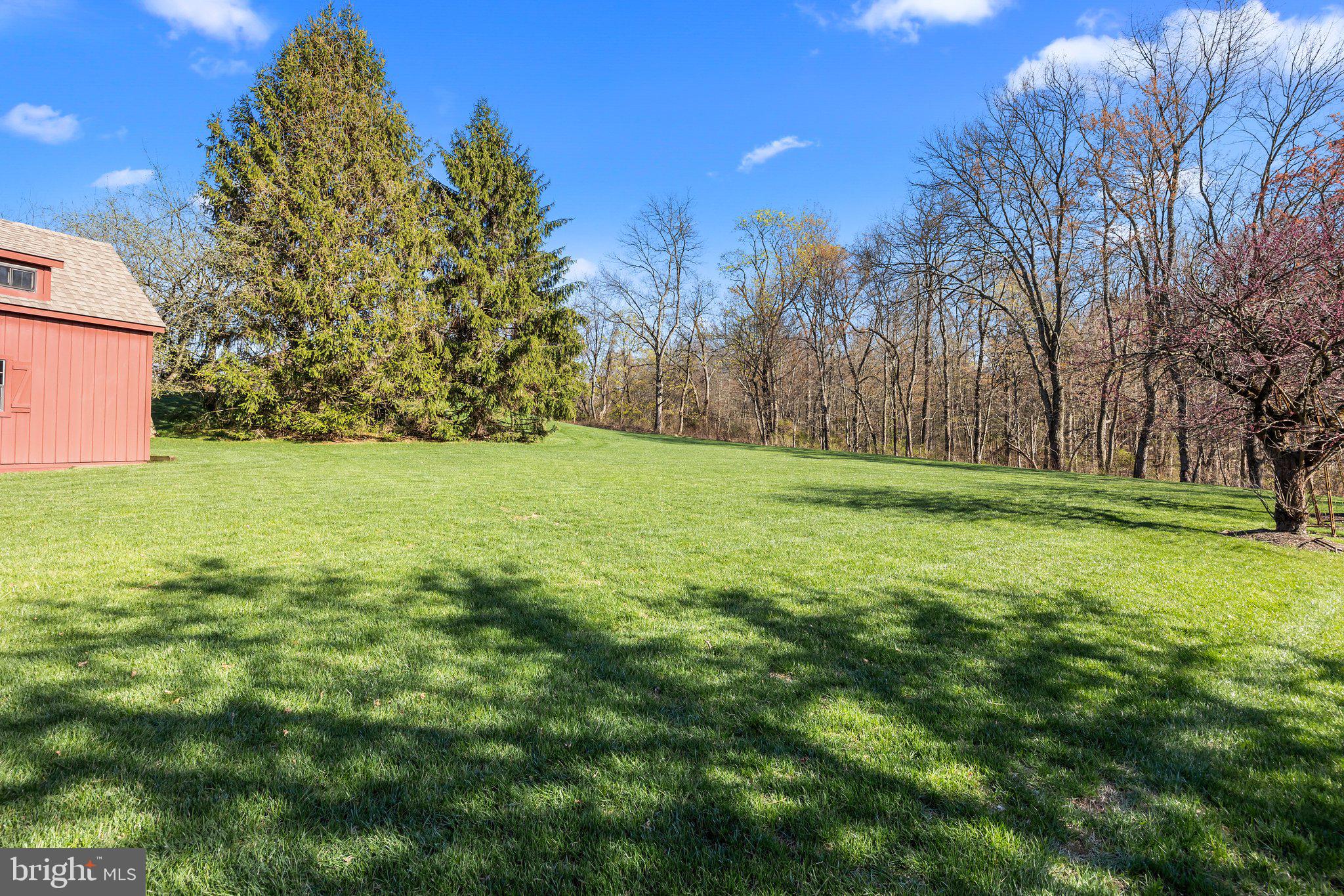 85 Brownsburg Road Newtown, PA 18940 - Photo 53 of 66 a backyard of a house with lots of green space