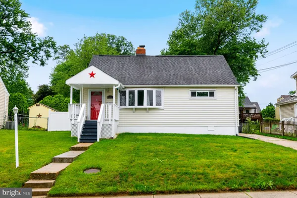 a view of a house with a yard patio and a garden