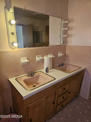 a bathroom with a sink and a mirror