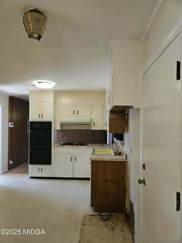 a view of a kitchen with a sink